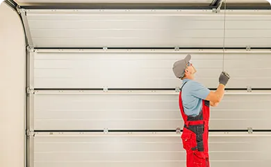 Licensed Textro Door technician servicing a residential garage door in South Jersey