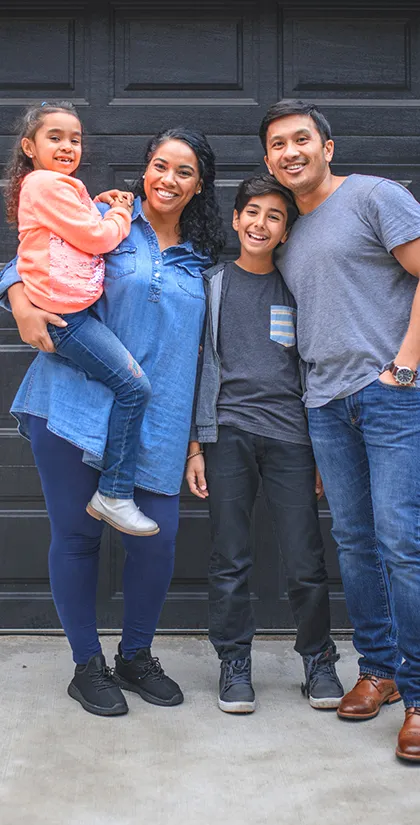 Happy Textro Door Company customers after a garage door installation